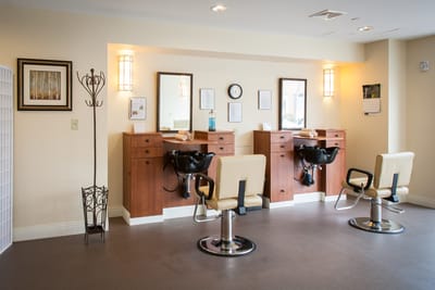 Interior view of a hair salon with styling stations