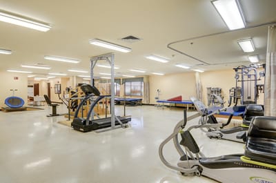 Interior view of a well-equipped physical therapy gym