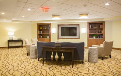 Interior common area with seating and bookshelves