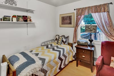 Cozy resident room with bed and window