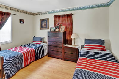 A shared bedroom with twin beds and personal touches