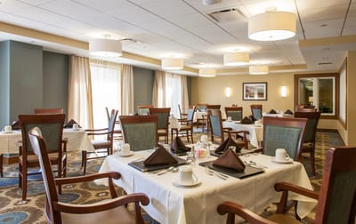 Dining room set up with tables and chairs