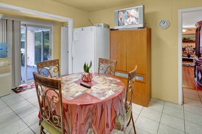 Dining area with a table and chairs in a bright room
