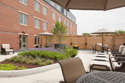 Outdoor patio area with seating and plants