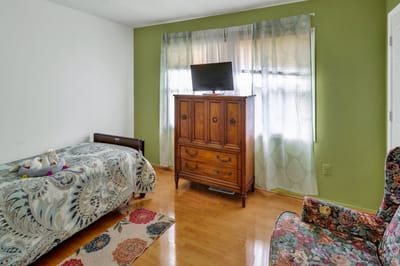 Cozy resident room with a bed and furniture