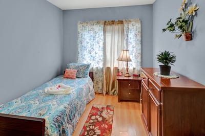 Bright private room with a bed and decorative elements