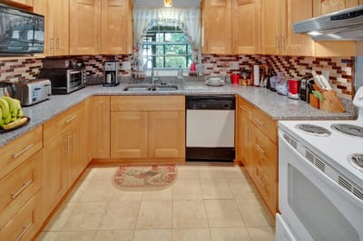 Bright kitchen area with modern appliances and decor
