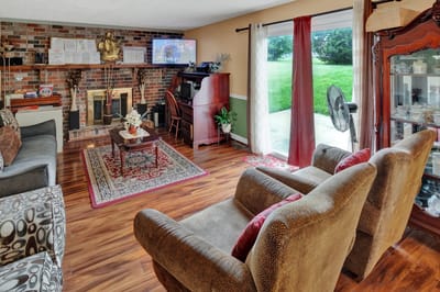 Comfortable living room with seating and bricks