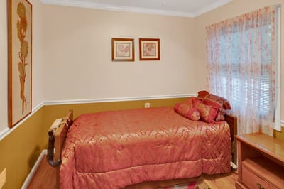 Cozy bedroom with warm colored decor and furnishings