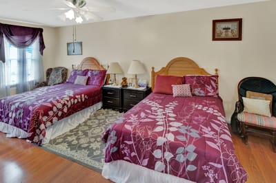 A well-furnished shared resident room with two beds