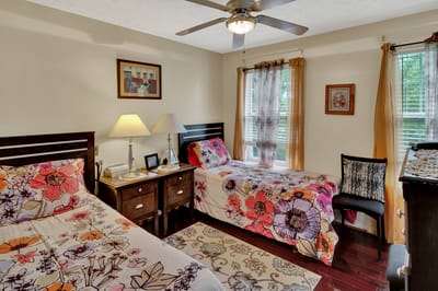 Bright shared resident bedroom with floral decor