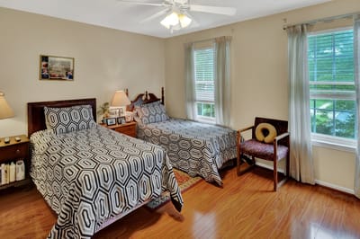 Cozy interior view of two twin beds in a resident room