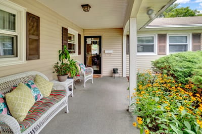 Welcoming porch with flowers and seating