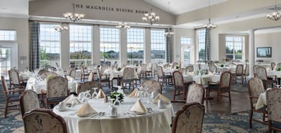 Elegant dining room setup with tables and chairs