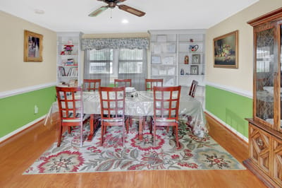 Bright dining area with a large table and chairs