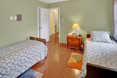 Interior view of a shared resident room with beds and furnishings