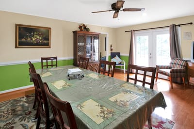 Dining area with a large table and decorative elements