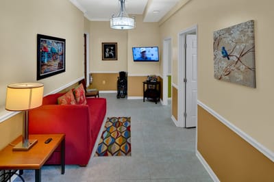 Bright interior common area with seating and artwork
