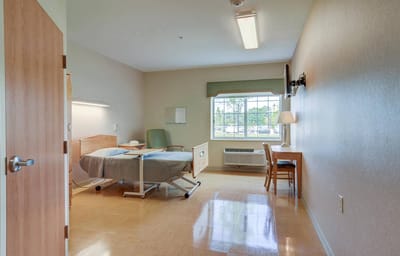 Private resident room with bed and window