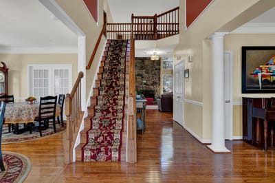 Interior view of a welcoming living area with staircase