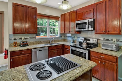 Modern kitchen interior with wooden cabinets and appliances