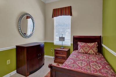 Private resident room with a bed and furniture