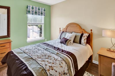 Cozy bedroom with a queen-sized bed and natural light
