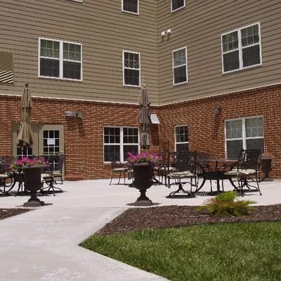 Outdoor patio area with seating and flowers
