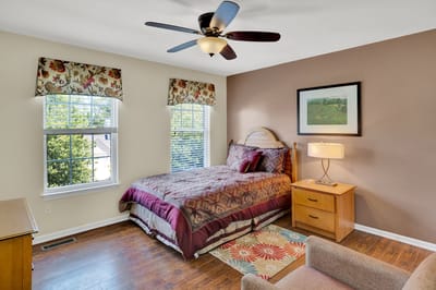 Cozy interior of a resident's bedroom with natural light