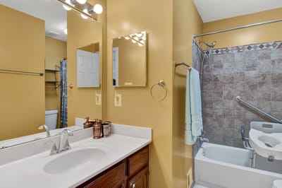 Brightly lit bathroom with safety features