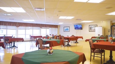Interior dining room with green and red tablecloths