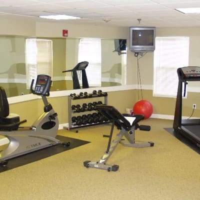 Fitness area with exercise equipment and mirrors