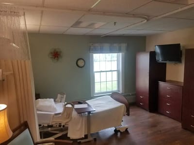 Private resident room with a bed and furnishings