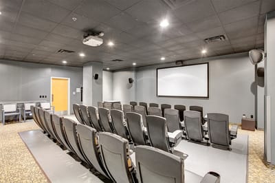 Interior of a theater room with seating and projector