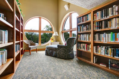 Cozy library corner with bookshelves and seating