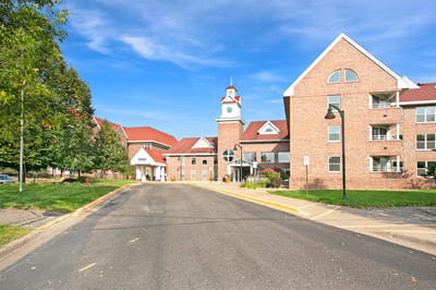 Exterior view of the facility building with landscaped grounds