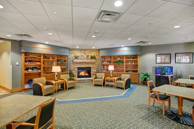 Cozy common area with seating and a fireplace
