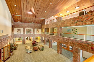 Interior view of a spacious common area with seating