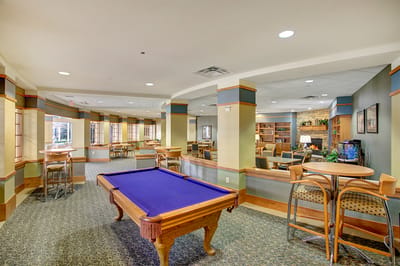 Interior common area with pool table and seating