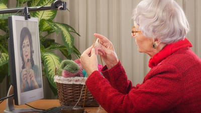 Resident knitting while video chatting