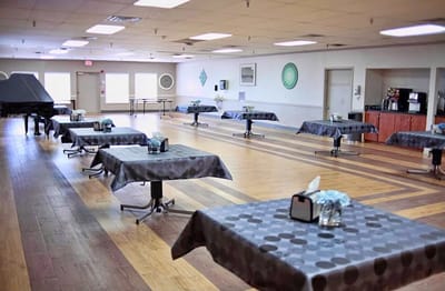 Bright common area with tables set for activities