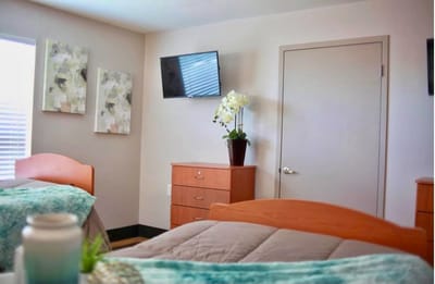 Shared resident room with beds and decor