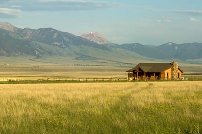 A quaint building in a vast outdoor landscape