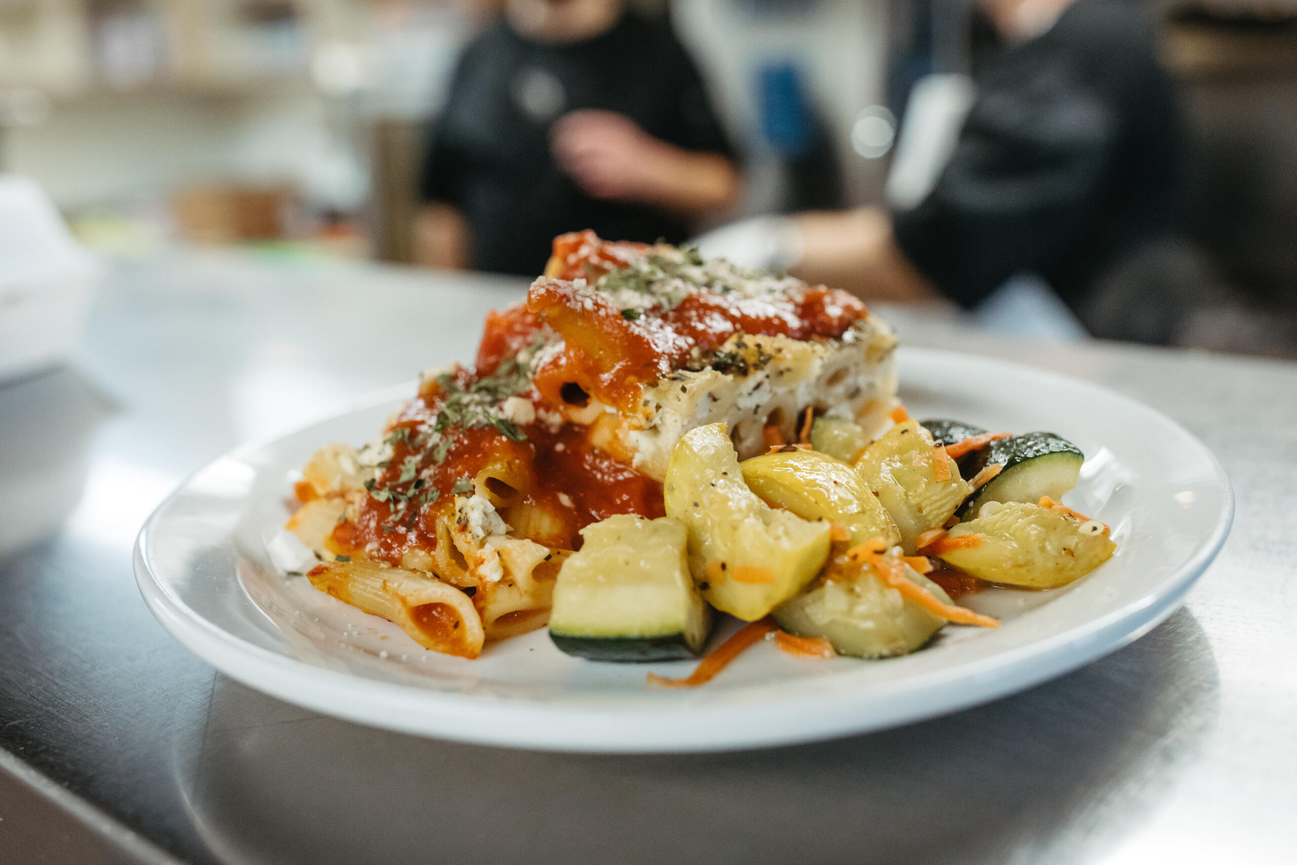 Close-up of a plated meal with pasta and vegetables