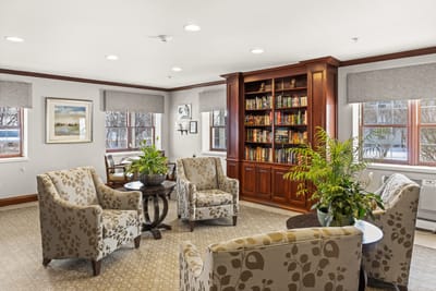 Interior common area with seating and bookshelves