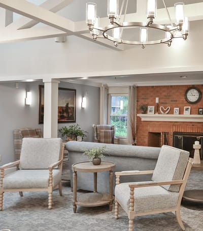 Cozy common area with chairs and a fireplace