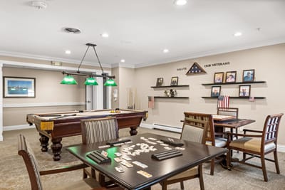 Common area with a pool table and military honors