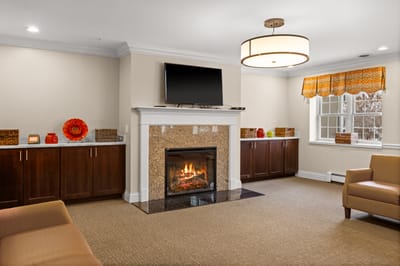 Cozy common area with a fireplace and seating
