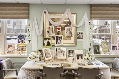 Decorative display celebrating recent marriages with photos