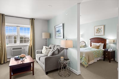 Bright, cozy resident room with a living area
